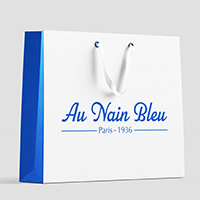 Au Nain Bleu logo on a bag